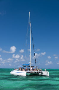 White catamar on turquoise ocean near Cayo Blanco, Cuba