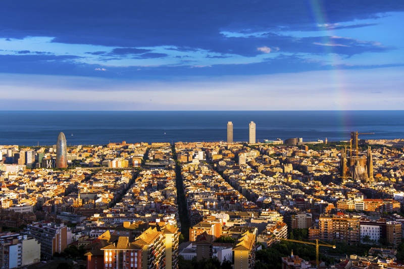 rainbow and barcelona skyline